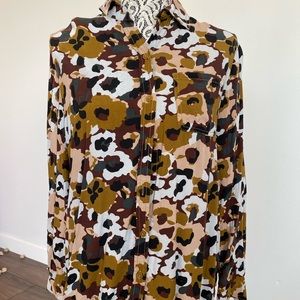 Woman’s button up blouse with army/flower pattern